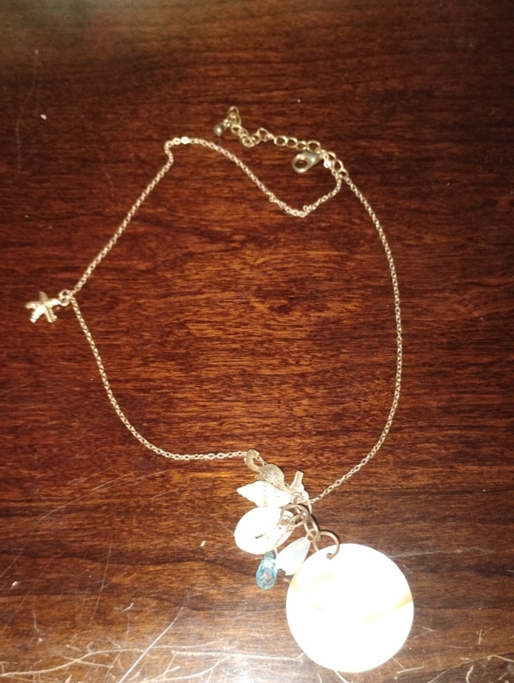 Gold-Tone Shell Charm Necklace with Blue Accent